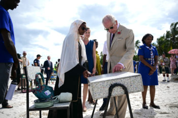 King Charles speaking with one of the innovators on the beach